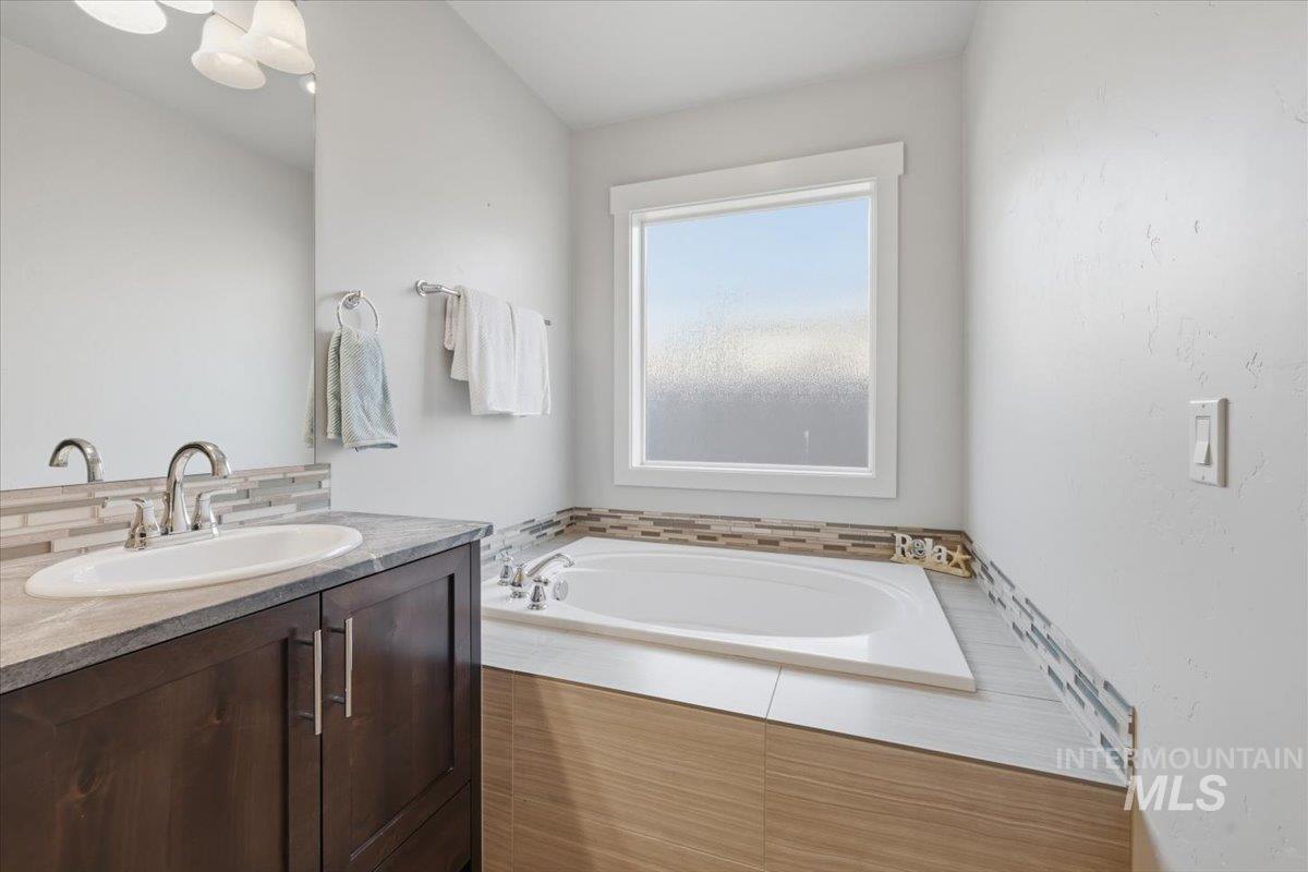 15381 Silver Oak Way Caldwell, ID 83607 - Photo 28 of 48 Bathroom featuring vanity and a garden tub