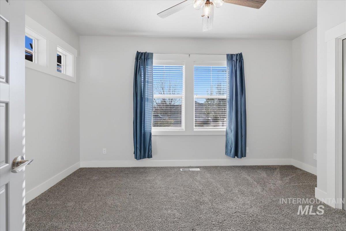 15381 Silver Oak Way Caldwell, ID 83607 - Photo 31 of 48 Spare room featuring carpet flooring and a ceiling fan