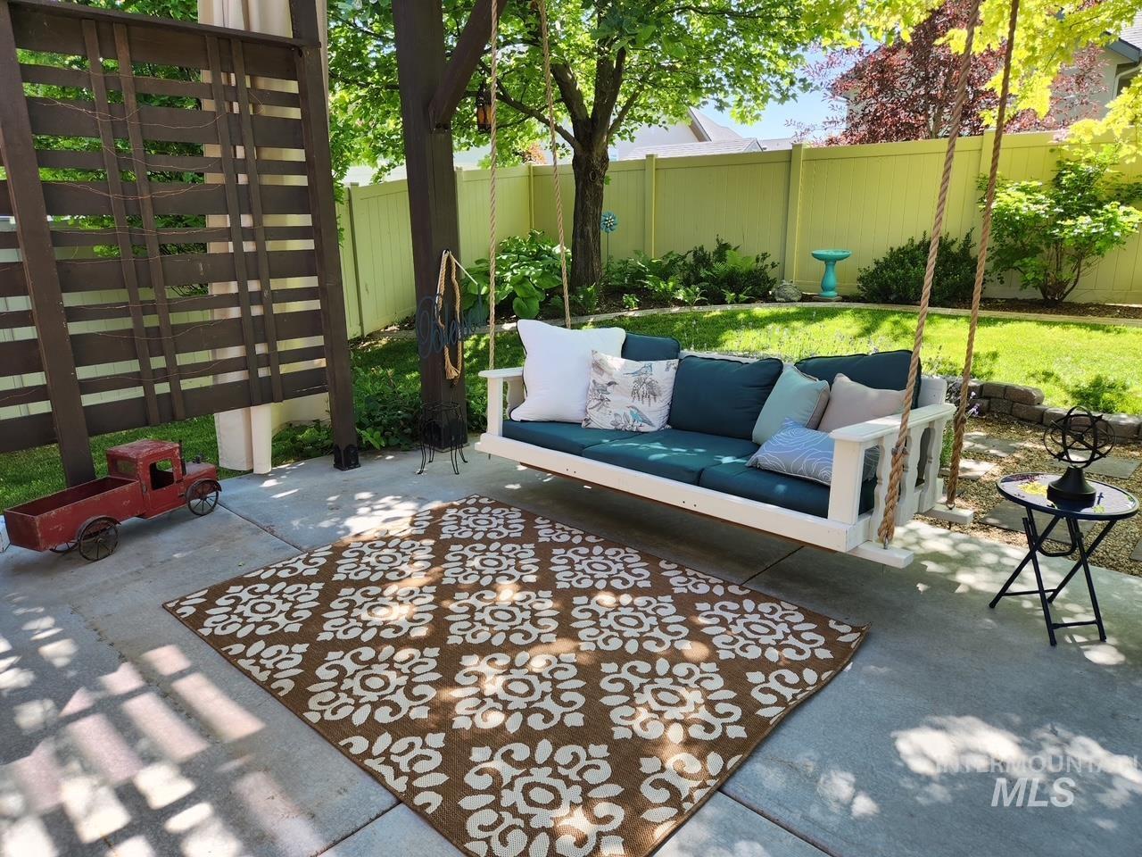15381 Silver Oak Way Caldwell, ID 83607 - Photo 41 of 48 Fenced backyard with a patio and outdoor seating