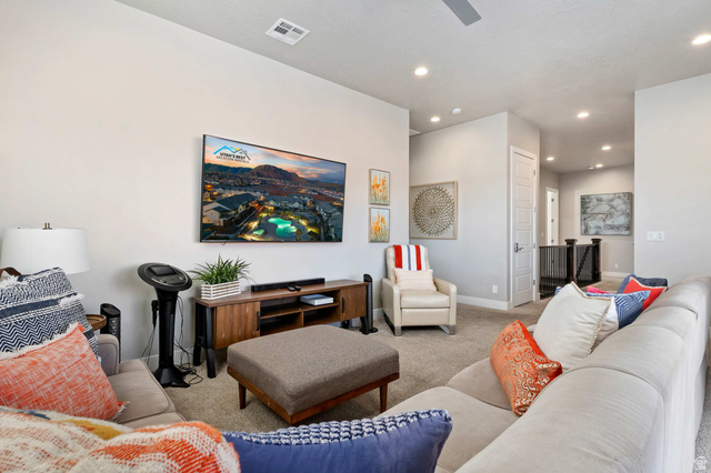 2600 Ocotillo Way, Unit 31 Santa Clara, UT 84765 - Photo 27 of 73 Carpeted living area featuring recessed lighting, a ceiling fan, and a wall-mounted flat-screen television