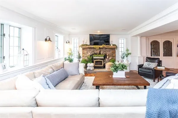 a living room with furniture and a fireplace