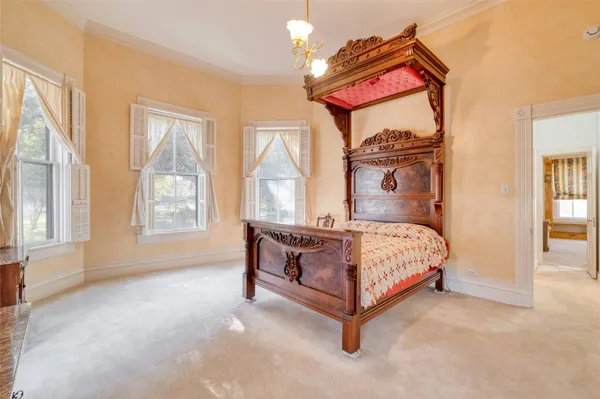 a view of a bedroom with furniture and staircase