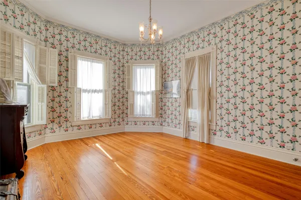 a view of livingroom with hardwood floor and a ceiling fan