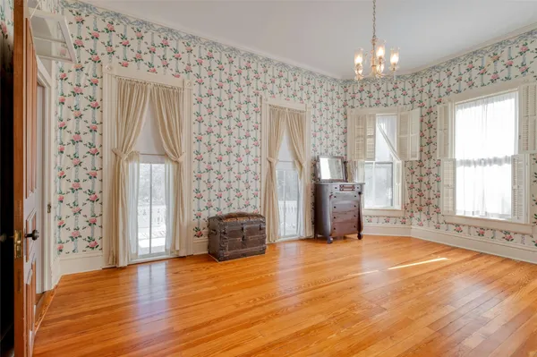 a bedroom with a bed and a fireplace