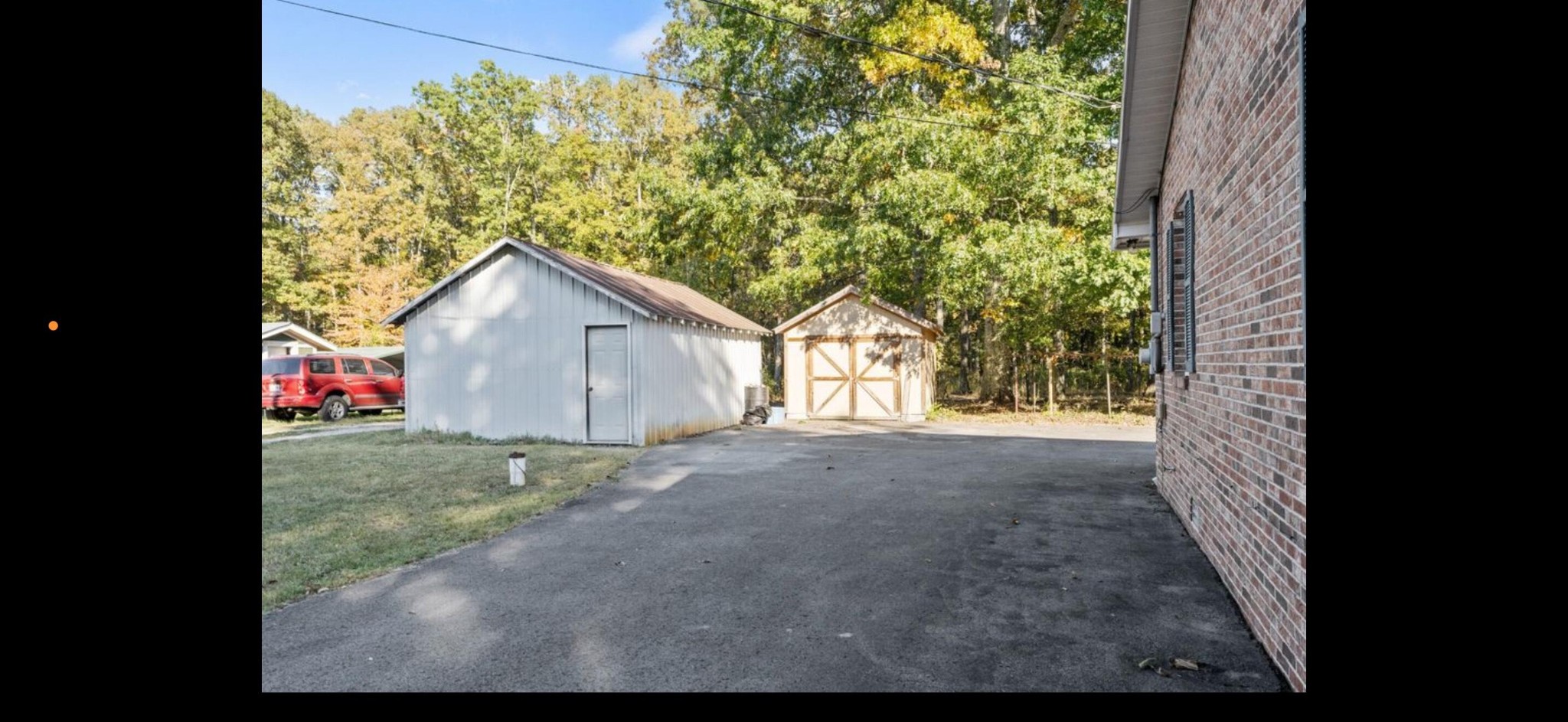 611 Thacker Road Manchester, TN 37355 - Photo 9 of 23 a view of a house with a yard and garage