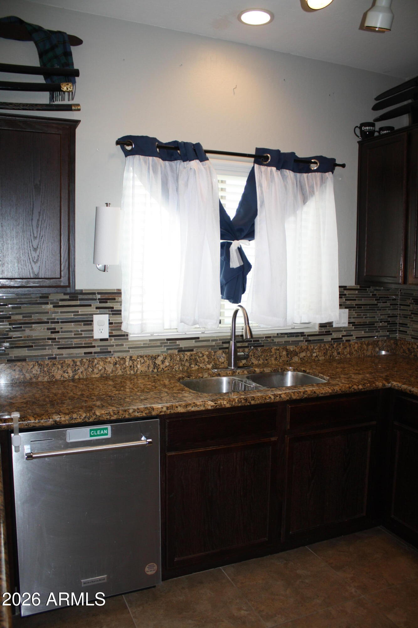 10225 West Camelback Road, Unit 19 Phoenix, AZ 85037 - Photo 9 of 51 a kitchen with granite countertop a sink and a stove