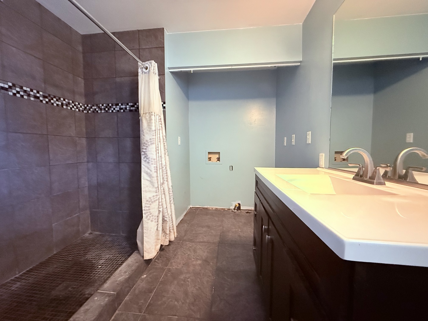 402 North Madison Street Clinton, IL 61727 - Photo 11 of 24 a bathroom with a sink and a mirror