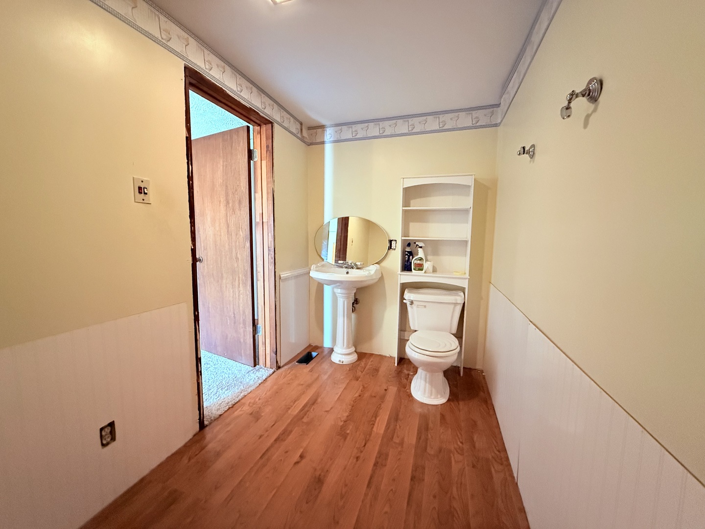 402 North Madison Street Clinton, IL 61727 - Photo 17 of 24 a bathroom with a sink and a toilet