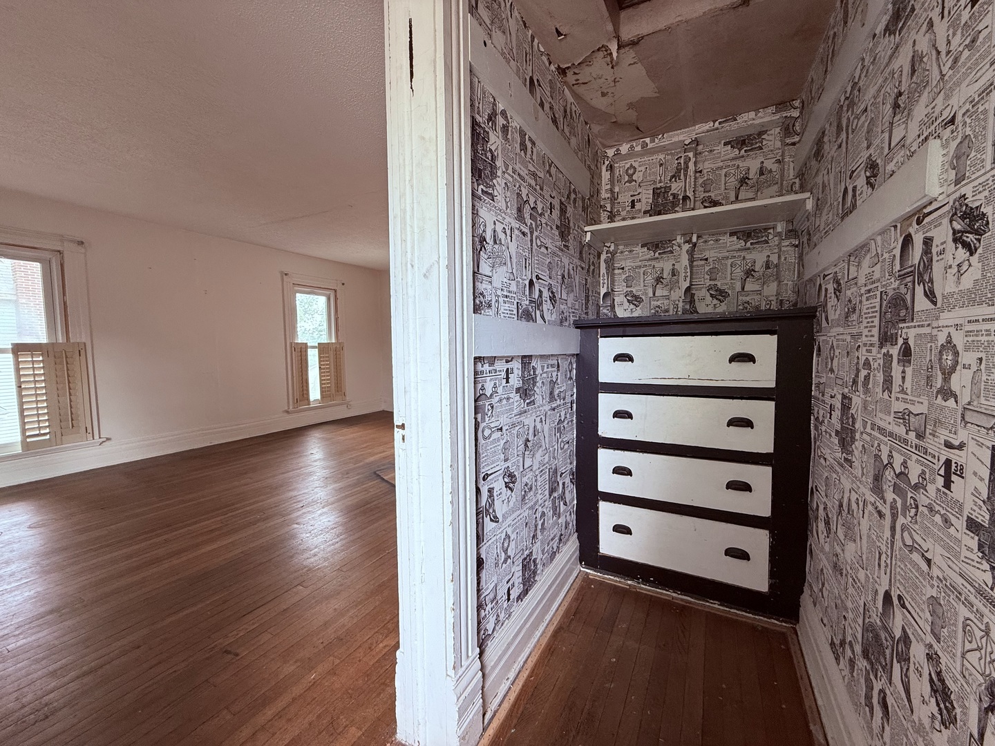 402 North Madison Street Clinton, IL 61727 - Photo 20 of 24 a view of an empty room with wooden floor