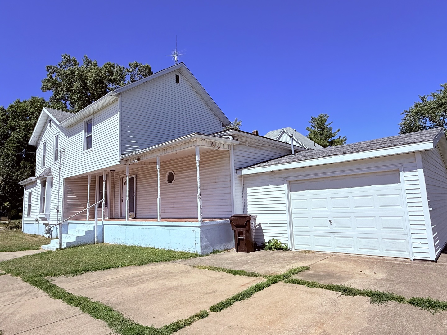 402 North Madison Street Clinton, IL 61727 - Photo 24 of 24 a front view of a house with a yard and garage