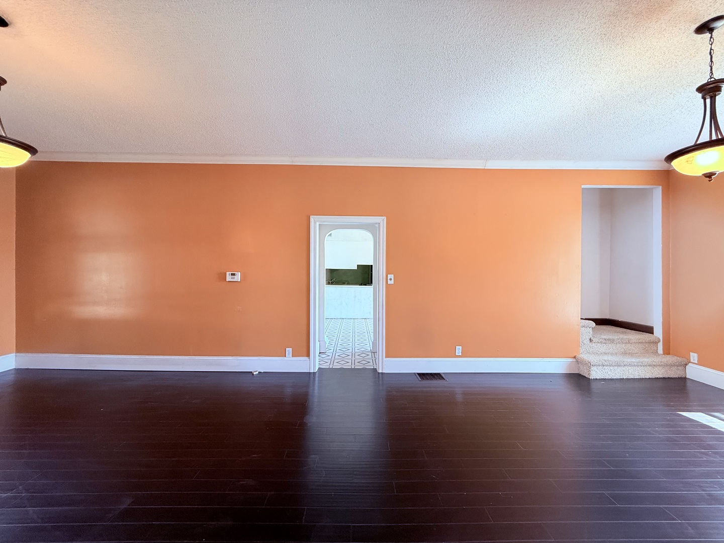 402 North Madison Street Clinton, IL 61727 - Photo 9 of 24 a view of an empty room with wooden floor