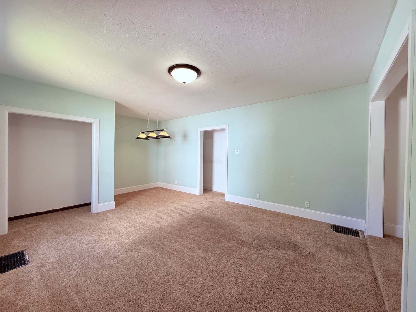 402 North Madison Street Clinton, IL 61727 - Photo 10 of 24 an empty room with closet and windows