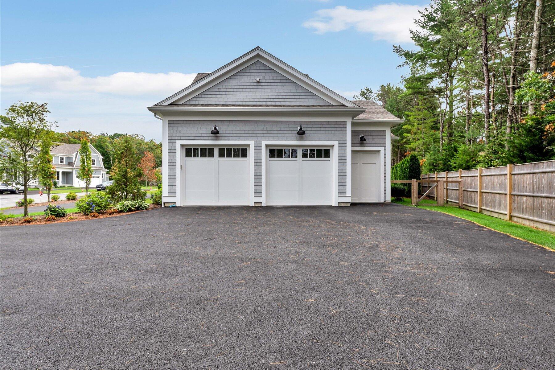 14 Willow Circle Mashpee, MA 02649 - Photo 14 of 60 a front view of a house with a yard