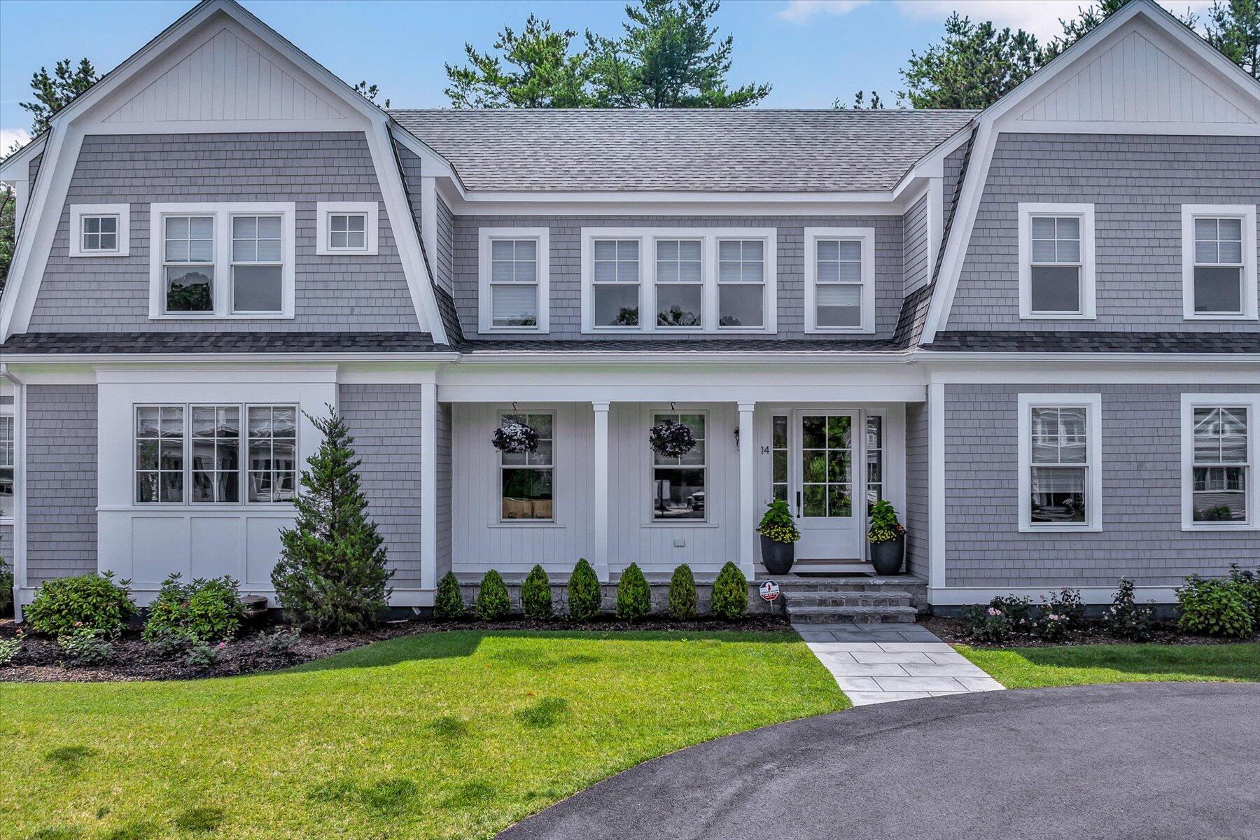 14 Willow Circle Mashpee, MA 02649 - Photo 16 of 60 front view of a brick house with a yard and large trees