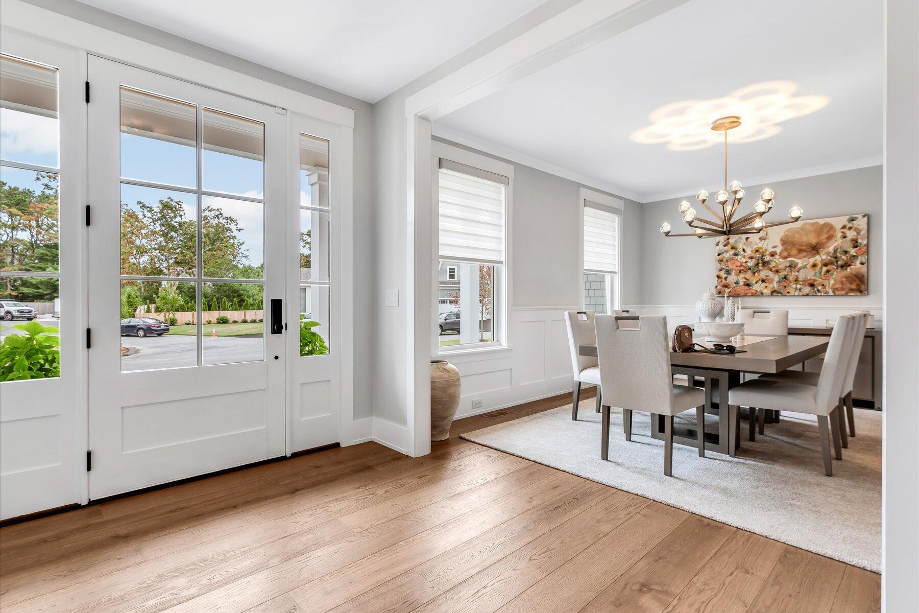 14 Willow Circle Mashpee, MA 02649 - Photo 18 of 60 a view of a dining room with furniture window and wooden floor