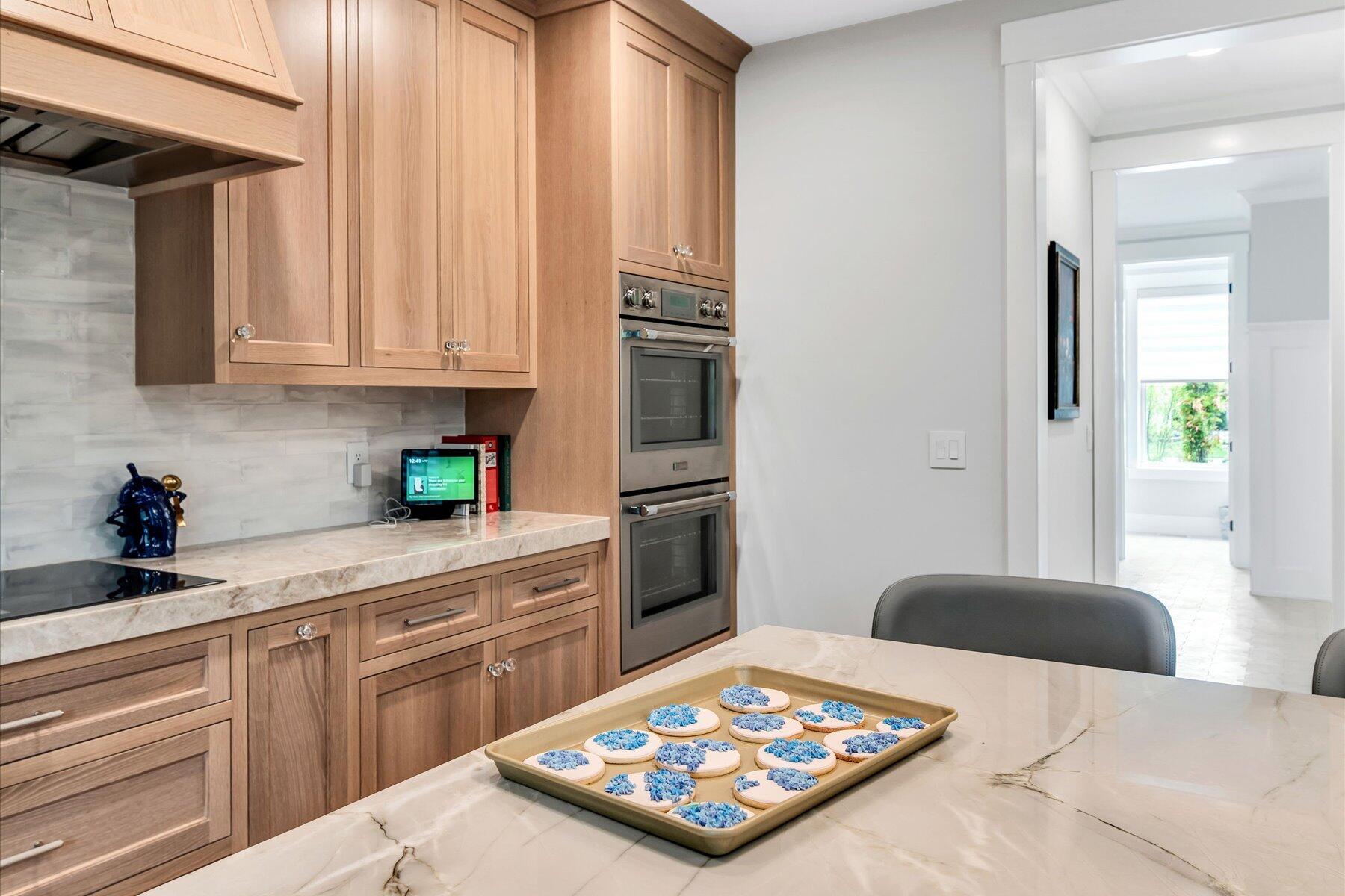 14 Willow Circle Mashpee, MA 02649 - Photo 29 of 60 a kitchen with kitchen island granite countertop a sink stainless steel appliances and cabinets