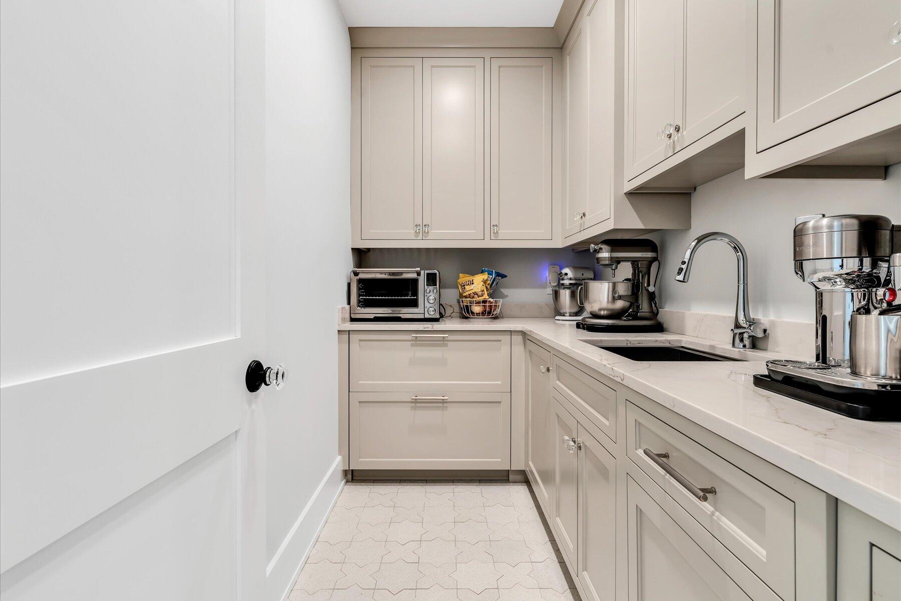 14 Willow Circle Mashpee, MA 02649 - Photo 35 of 60 a kitchen with white cabinets and white appliances