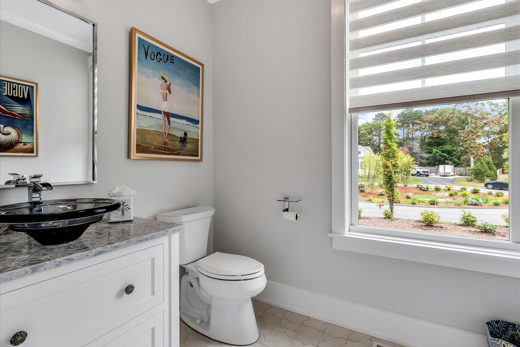 14 Willow Circle Mashpee, MA 02649 - Photo 37 of 60 a bathroom with a toilet a sink and a window