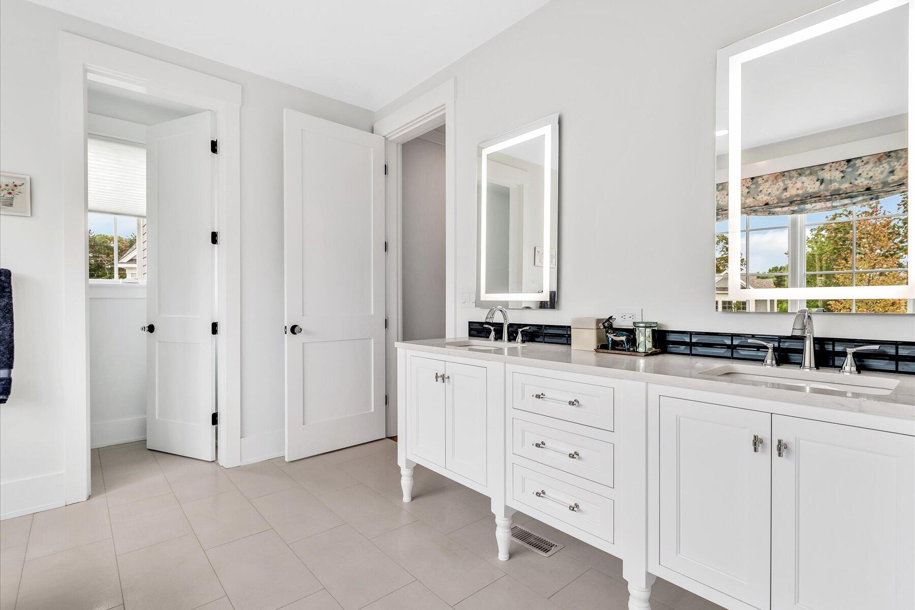14 Willow Circle Mashpee, MA 02649 - Photo 44 of 60 a bathroom with a granite countertop sink mirror and a