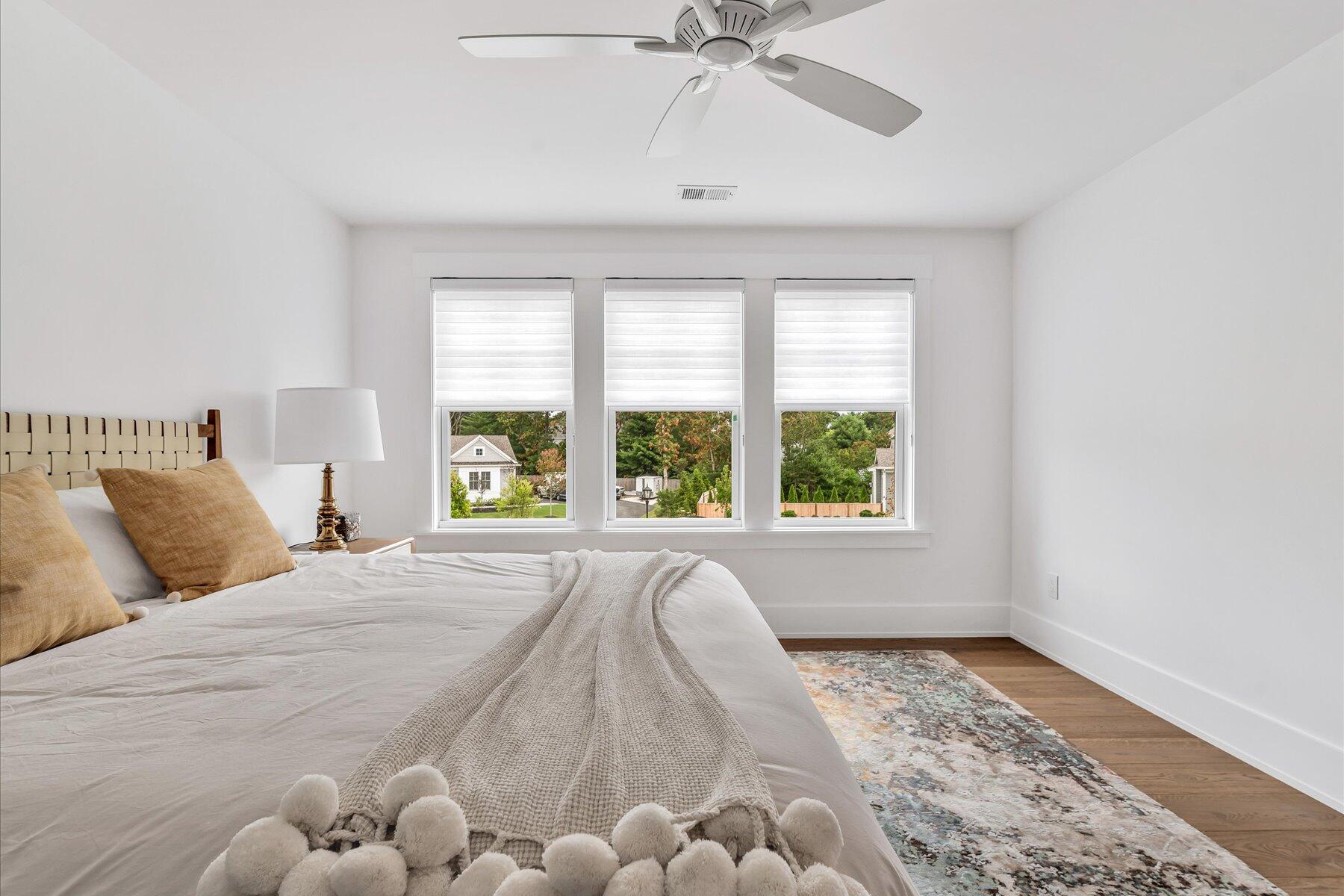 14 Willow Circle Mashpee, MA 02649 - Photo 54 of 60 a large bed sitting in a bedroom next to a window