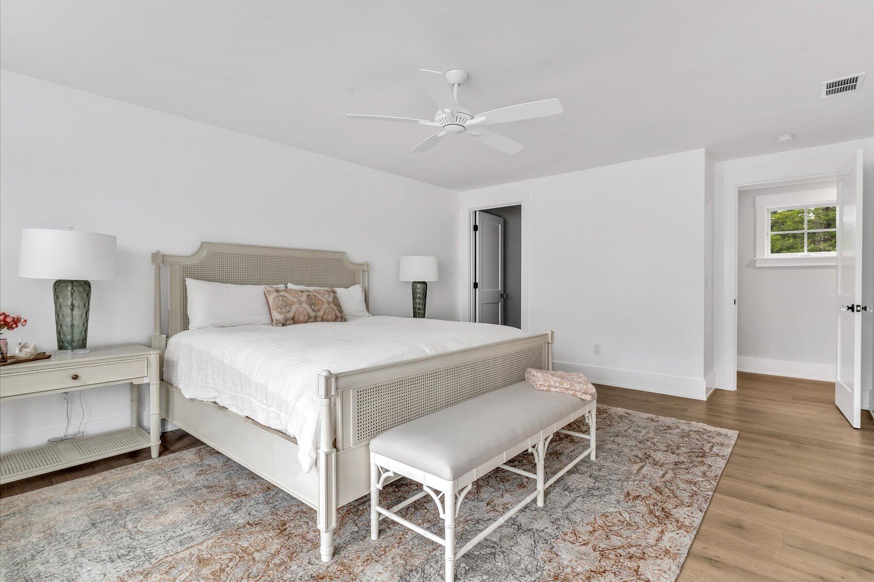 14 Willow Circle Mashpee, MA 02649 - Photo 58 of 60 a bedroom with a bed and wooden floor