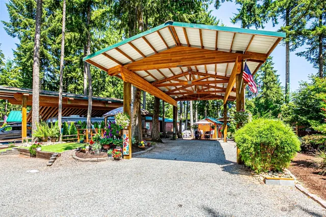 a view of the patio with a table and chairs under an umbrella