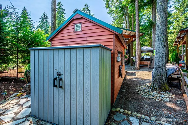 a view of a chairs and tables in the backyard
