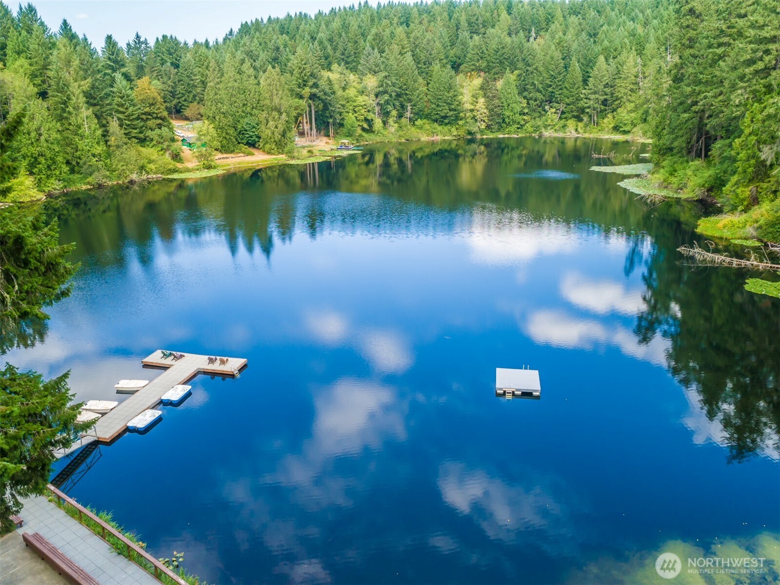 1546 Reservation Road Southeast, Unit 253 Olympia, WA 98513 - Photo 26 of 31 a view of a lake with a yard