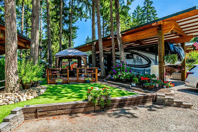 a view of a chairs and table in the garden