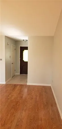 a view of an empty room with a window