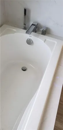 a bathroom with a granite countertop sink