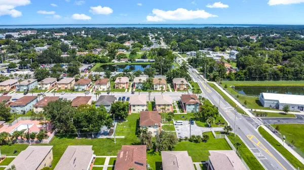 an aerial view of residential houses with outdoor space