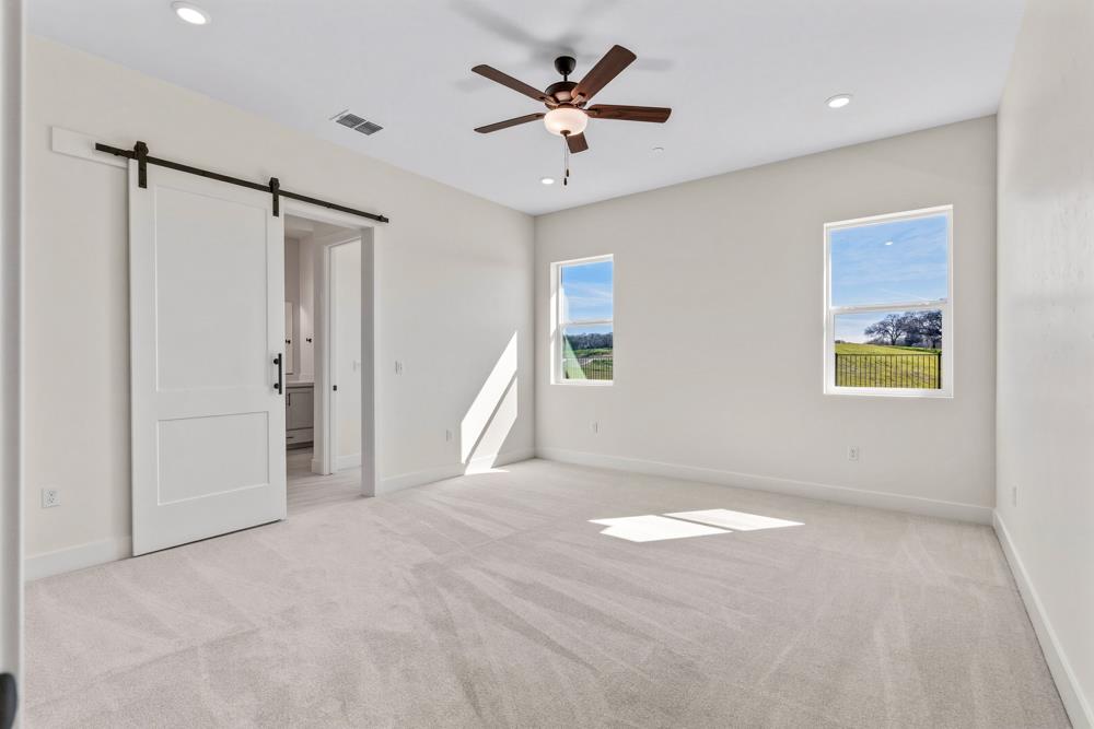 14834 Grace Warren Way Rancho Murieta, CA 95683 - Photo 13 of 18 a view of a livingroom with a ceiling fan and window