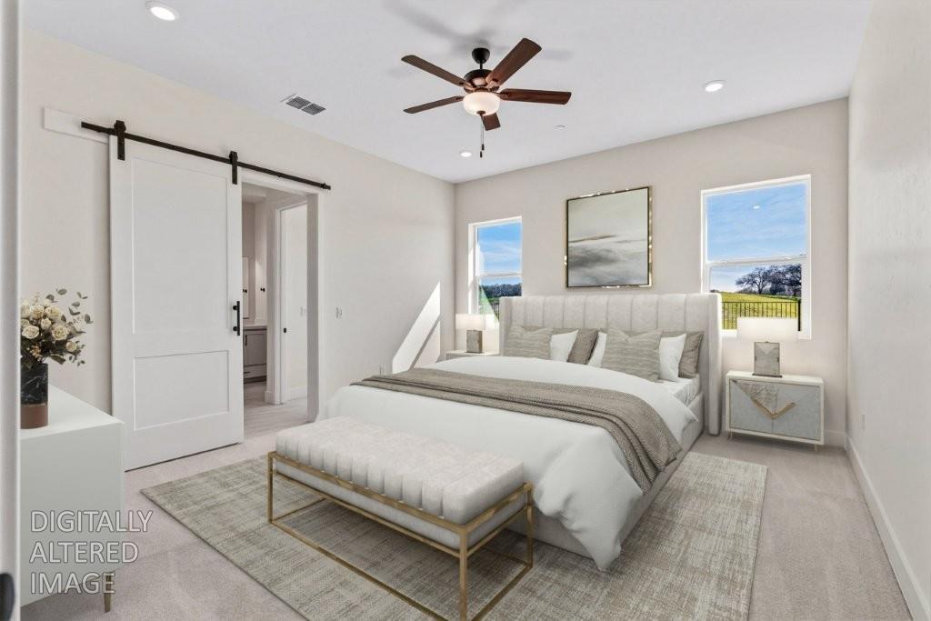 14834 Grace Warren Way Rancho Murieta, CA 95683 - Photo 15 of 21 a spacious bedroom with a bed and a chandelier