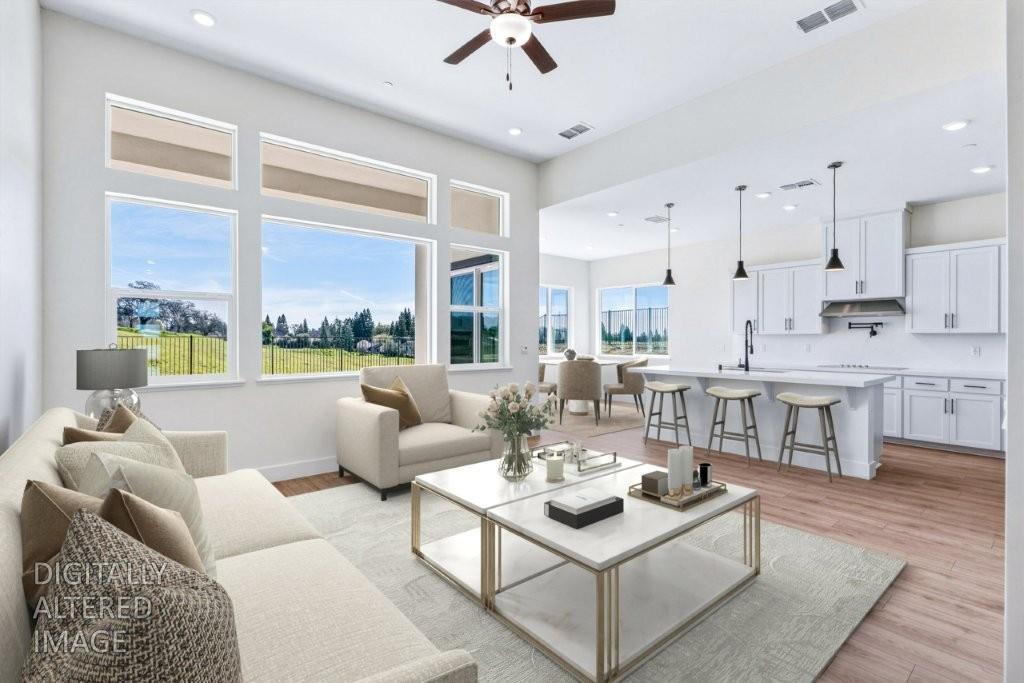 14834 Grace Warren Way Rancho Murieta, CA 95683 - Photo 4 of 21 a living room with furniture and a large window