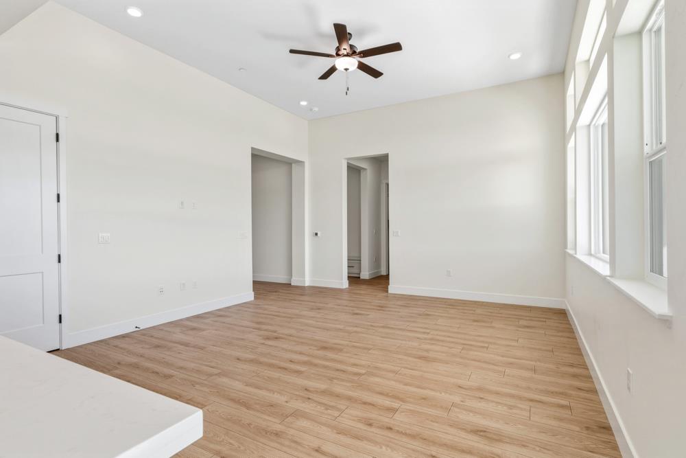 14834 Grace Warren Way Rancho Murieta, CA 95683 - Photo 6 of 18 wooden floor in an empty room with a window