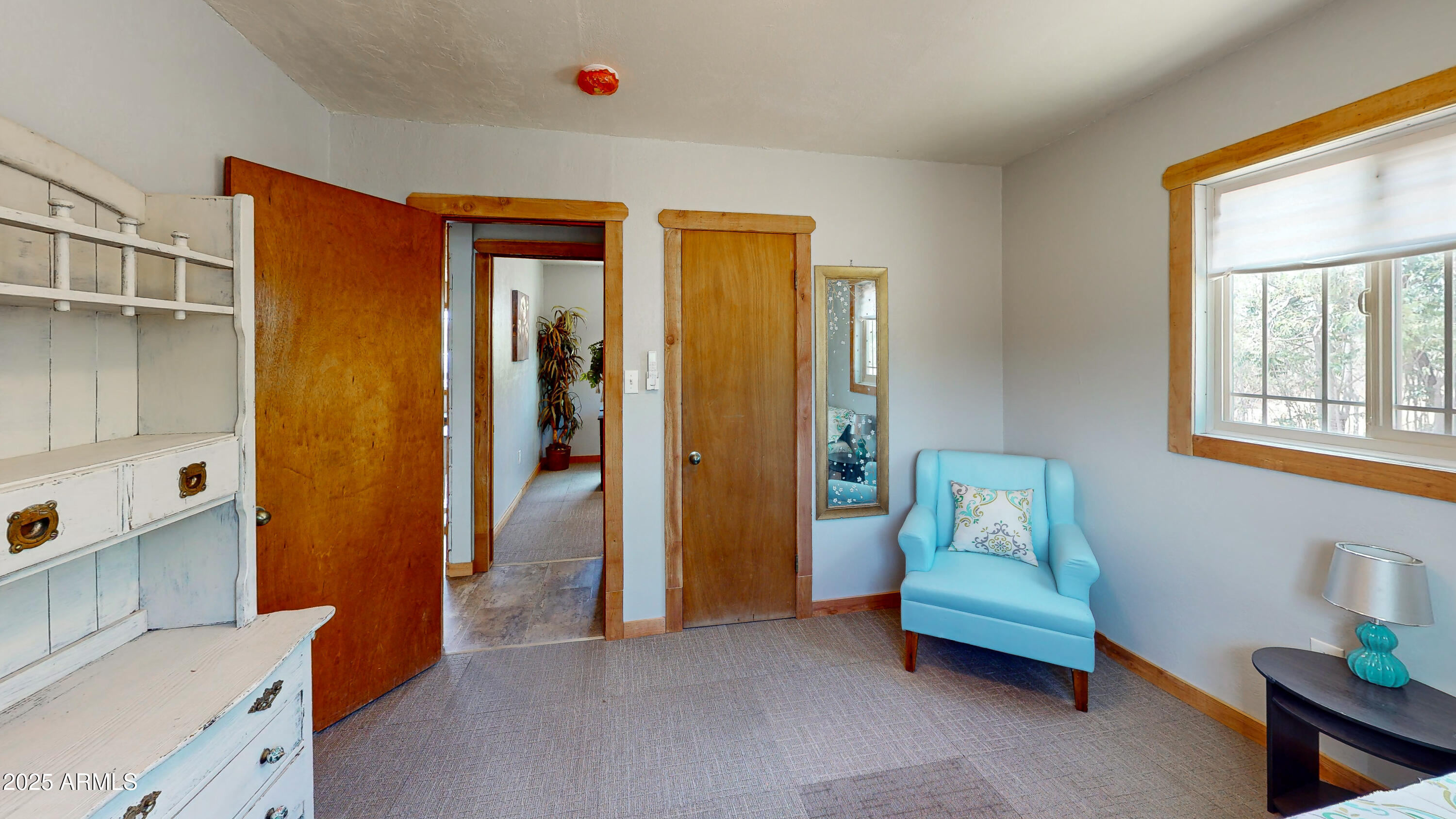 208 Hereford Road Bisbee, AZ 85603 - Photo 21 of 41 a bedroom with furniture and a window