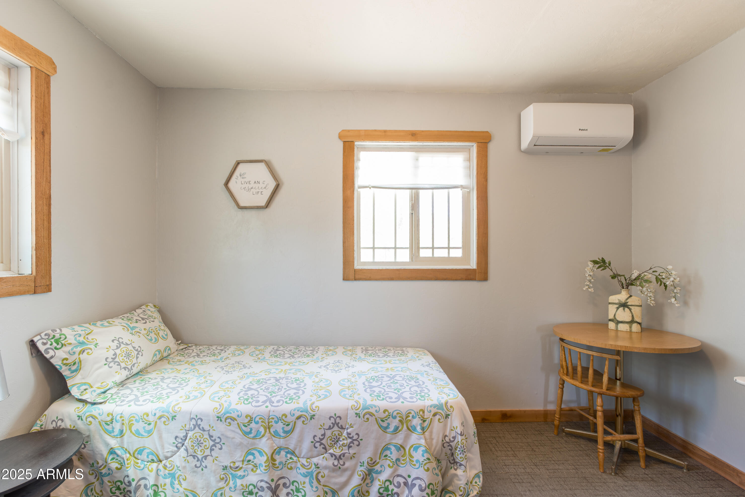 208 Hereford Road Bisbee, AZ 85603 - Photo 23 of 41 a bedroom with a bed and a table