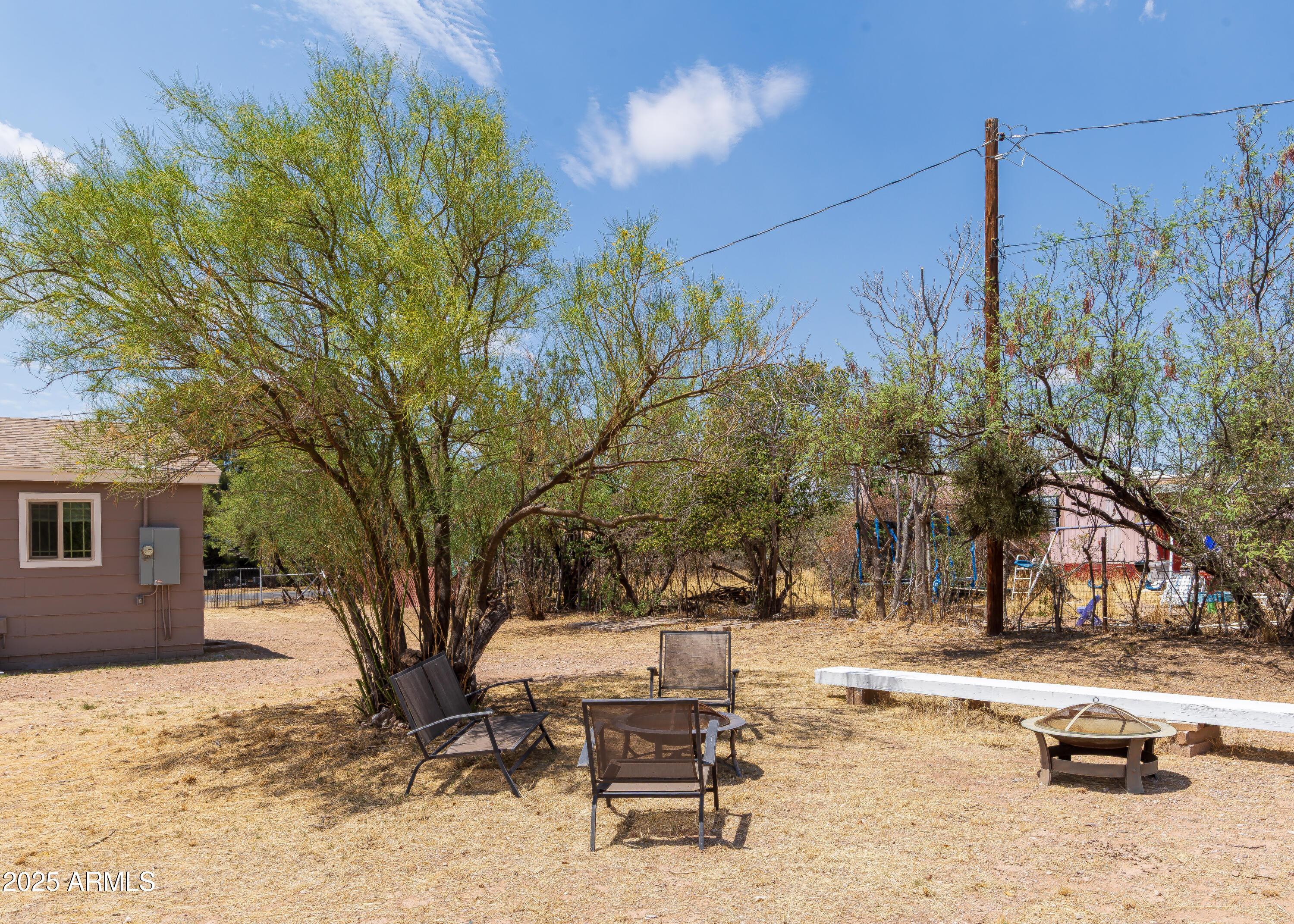 208 Hereford Road Bisbee, AZ 85603 - Photo 39 of 41 a swimming pool with outdoor seating and yard