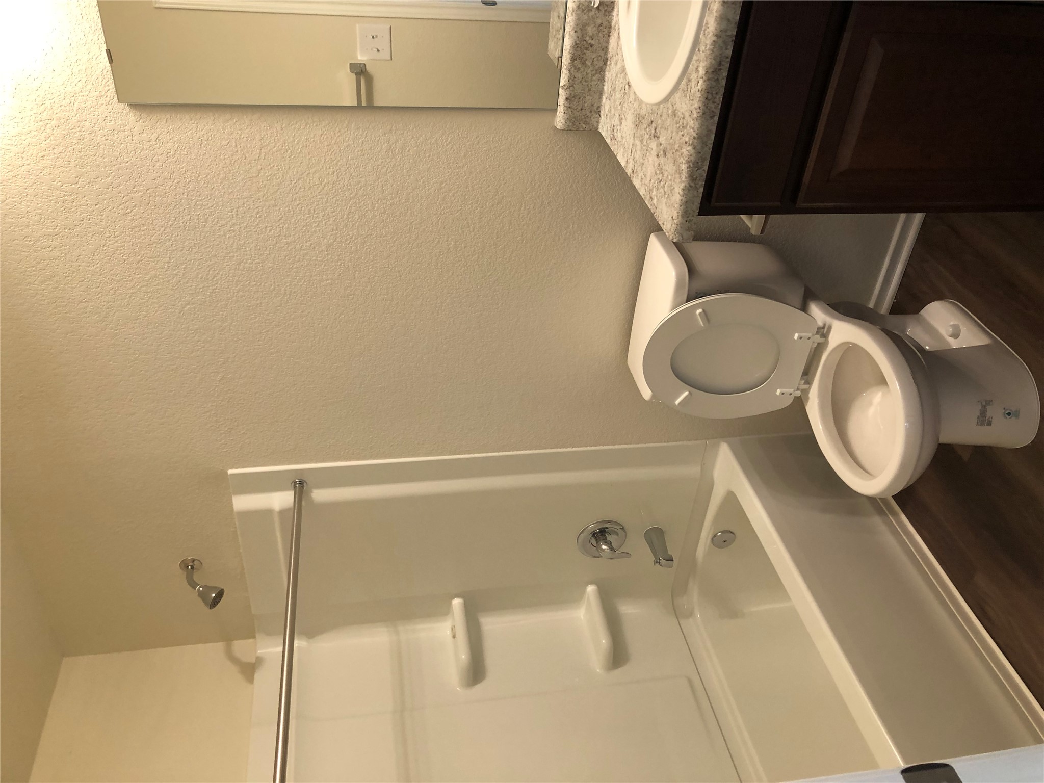 130 Lt Rusty Drive Jarrell, TX 76537 - Photo 6 of 13 First floor well-appointed bathroom features a standard tub and a sleek vanity.