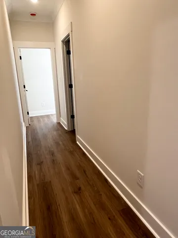 a spacious bathroom with double vanity and a mirror