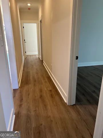 a spacious bathroom with a double vanity sink and mirror