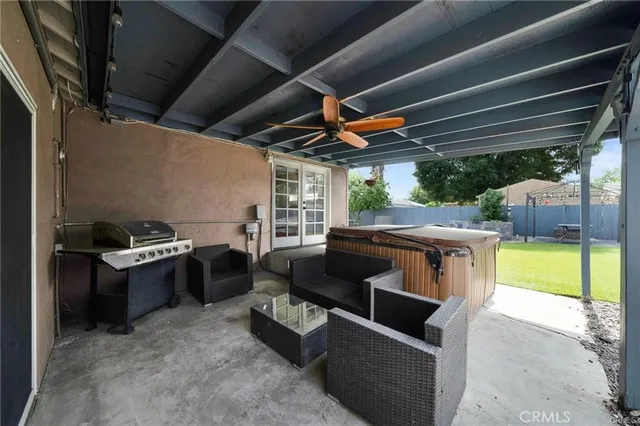 a patio with patio couch and a fireplace