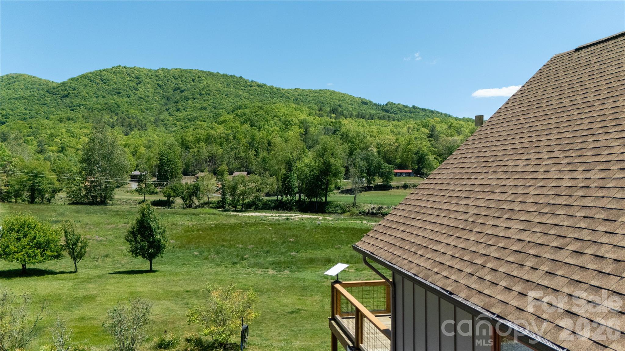 93 Franklin Crest Road Spruce Pine, NC 28777 - Photo 18 of 47 a view of a garden from a roof deck