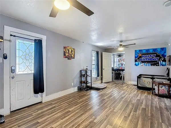 a view of a livingroom with furniture and a flat screen tv