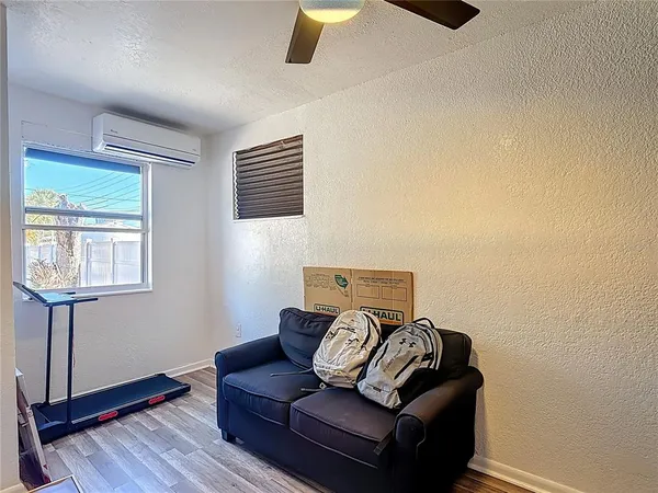 a view of a livingroom with furniture and wooden floor