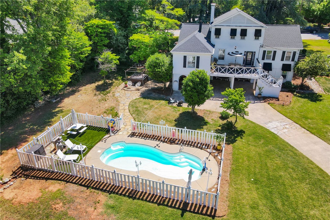 1107 Springdale Road Anderson, SC 29621 - Photo 43 of 49 This grand residence offers expansive outdoor living with a private pool, perfect for entertaining.