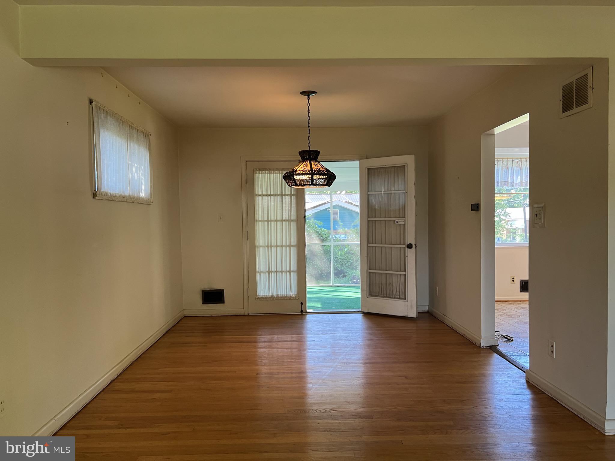 1801 Ladd Street Silver Spring, MD 20902 - Photo 4 of 16 Separate dining room leading to screened porch.