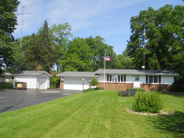 25018 Prophet Road Rock Falls, IL 61071 - Photo 1 of 8 a house view with a sitting space and garden