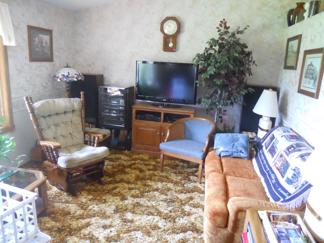 25018 Prophet Road Rock Falls, IL 61071 - Photo 2 of 8 a living room with furniture and a flat screen tv